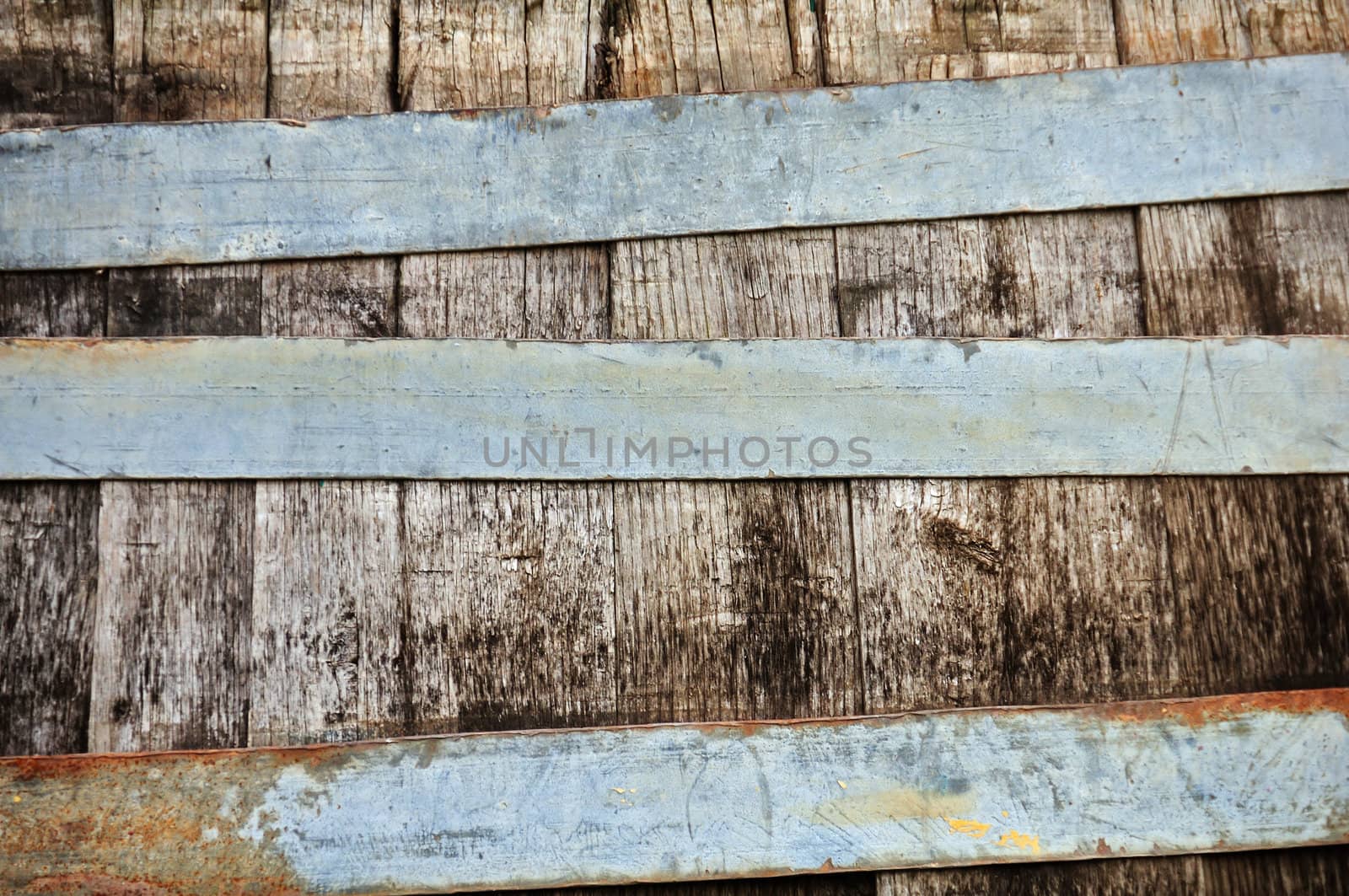Wooden barrel and rusty metal stripes texture.