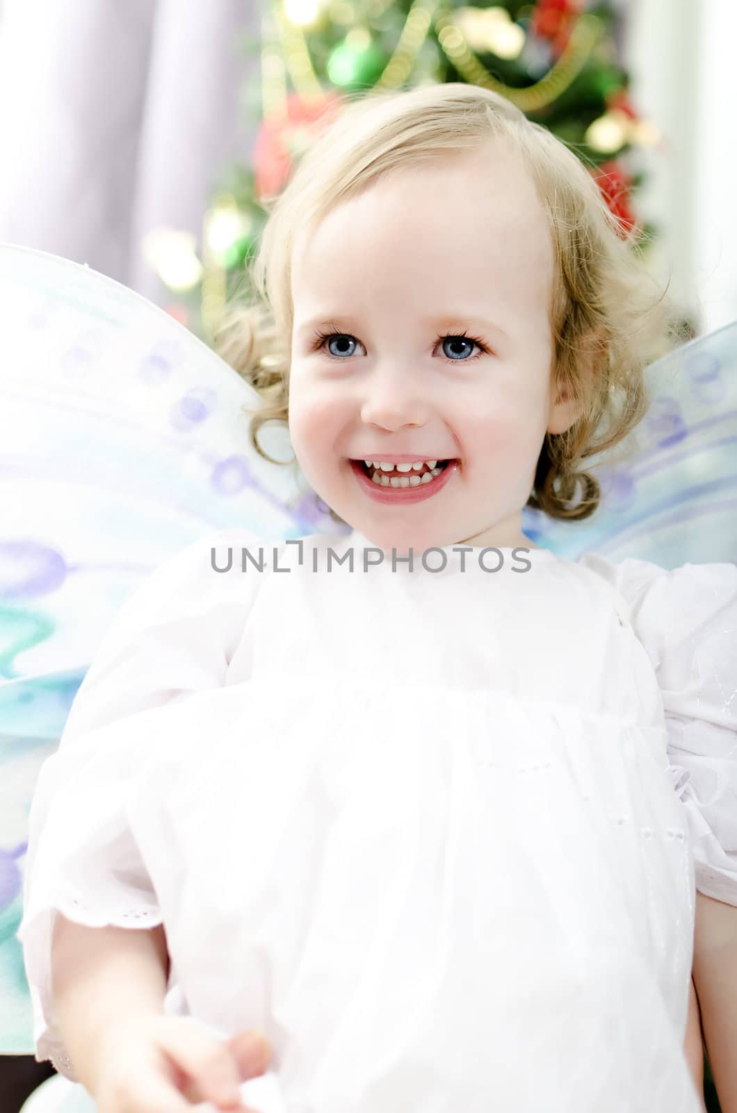 little girl smiling at Christmas