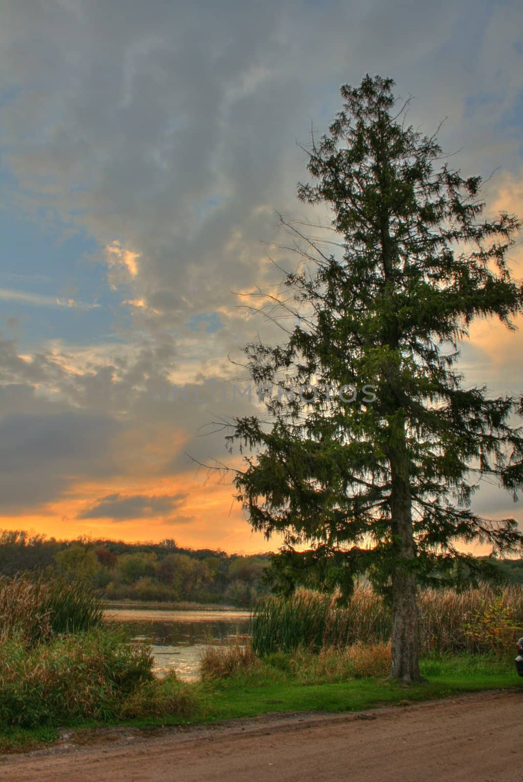 Sunset over a lagoon by jeremywhat