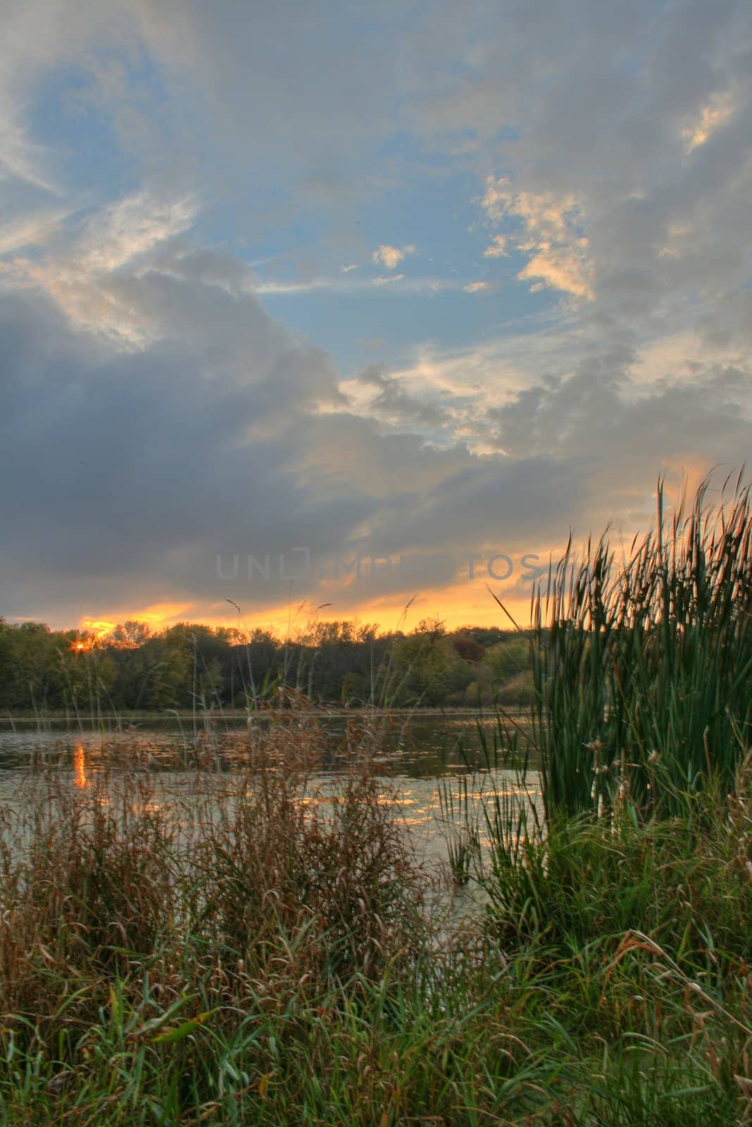 Sunset over a lagoon by jeremywhat