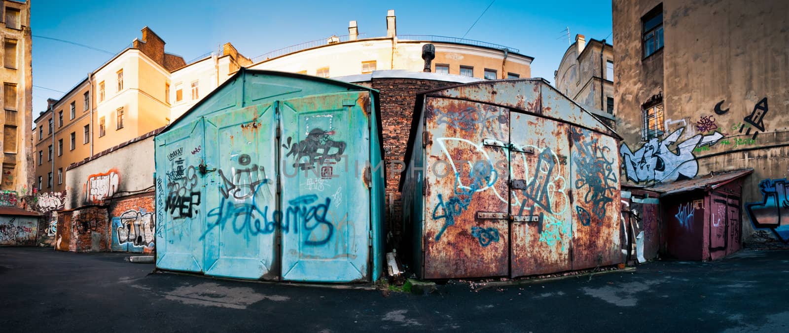 Old, closed, dusty and rusty garages in ghetto