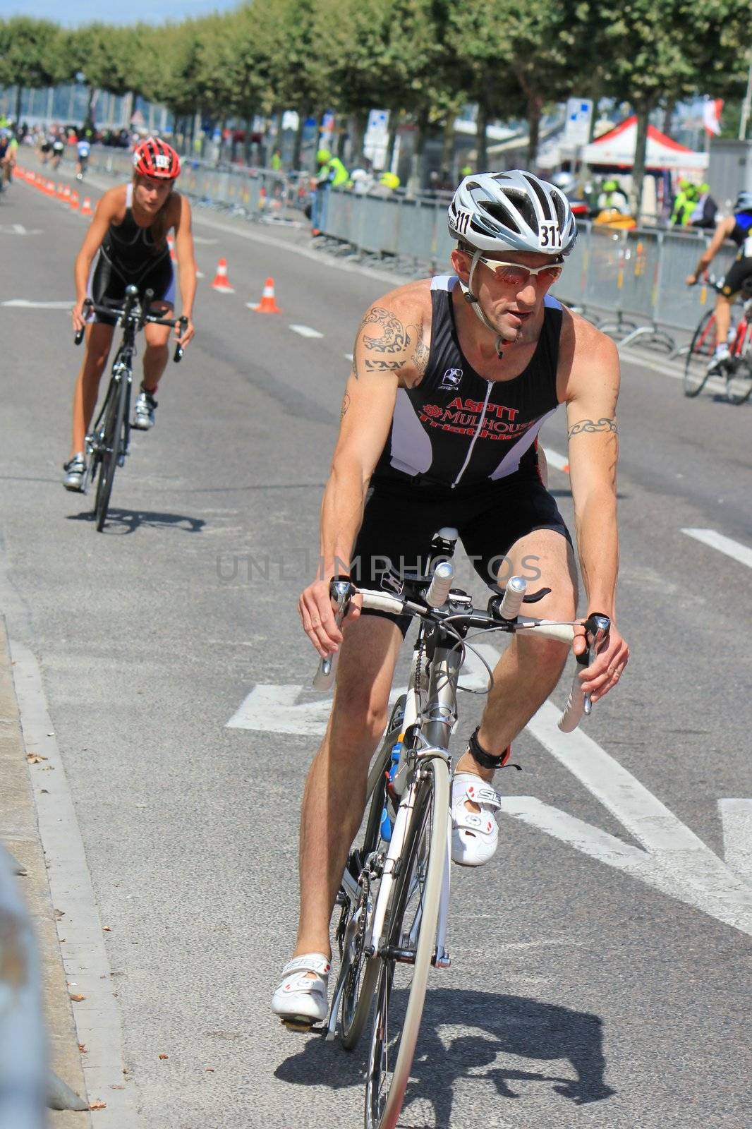 Cyclist with tattoes at the International Triathlon 2011, Geneva, Switzerland