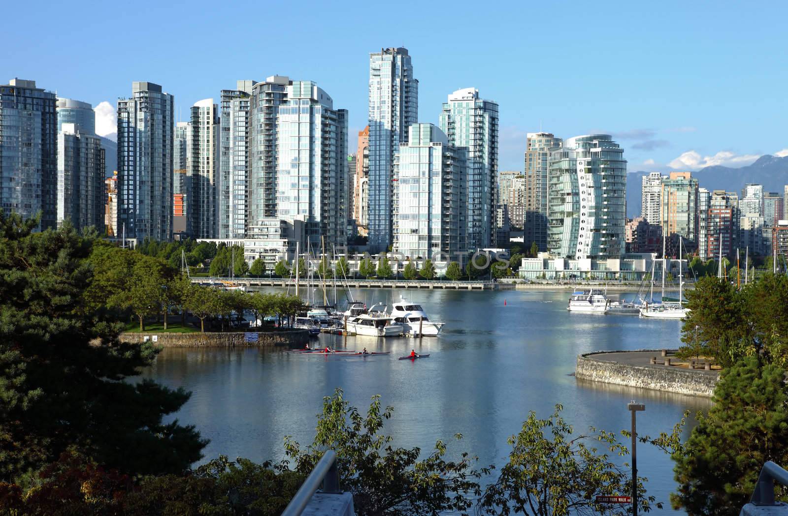 Vancouver BC waterfront False creek bay south side & sailboats.