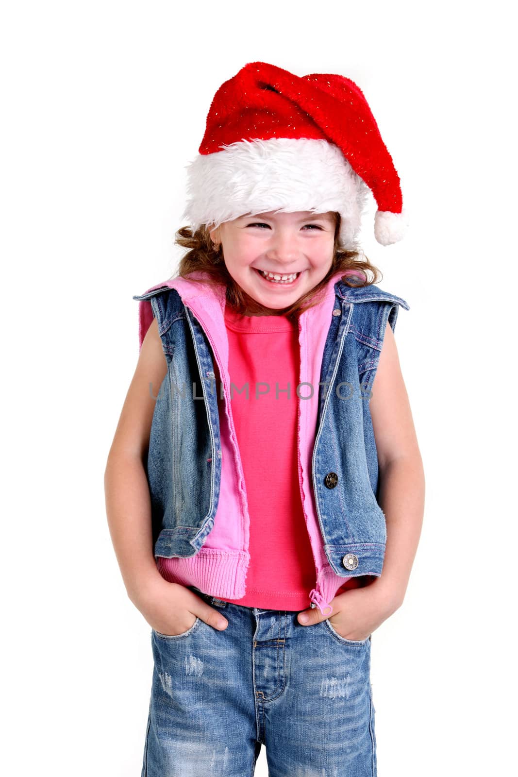 Little girl in denim suit and a hat of Santa Claus on the white background
