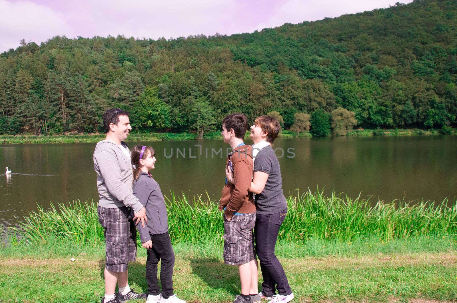 Father, mother, daughter, son in profile.