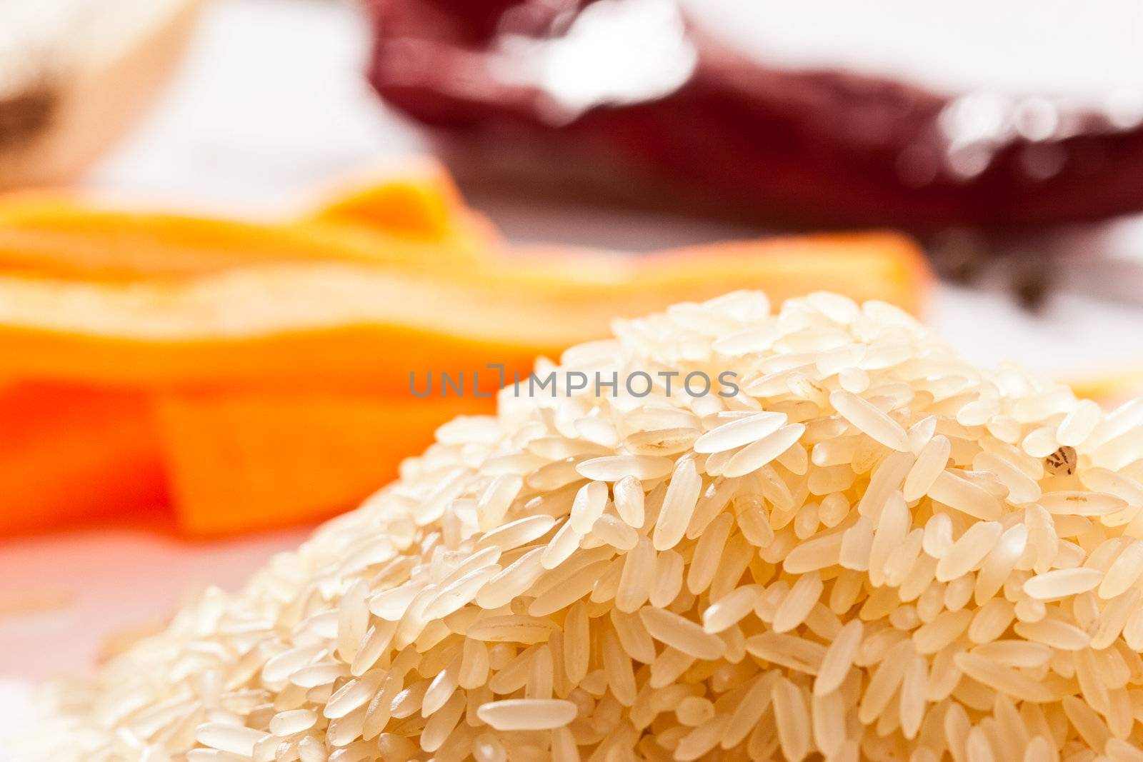 hill of raw rice with vegetables 
and parsley