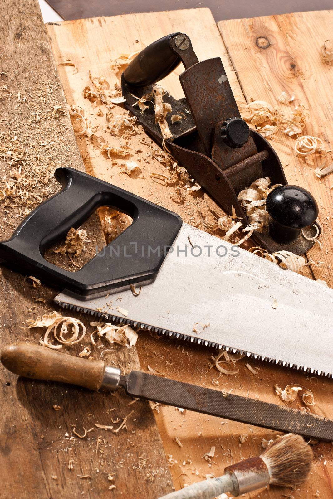 set of carpenters tool on tne wood and shavings
