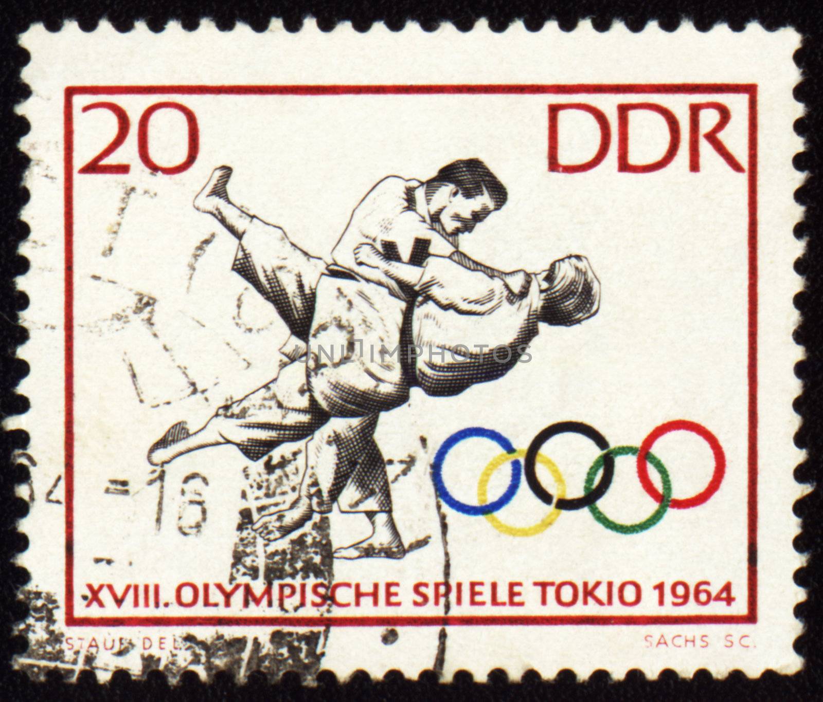 GDR - CIRCA 1964: A post stamp printed in GDR (East Germany), shows judo, devoted Olympic games in Tokio, series, circa 

1964