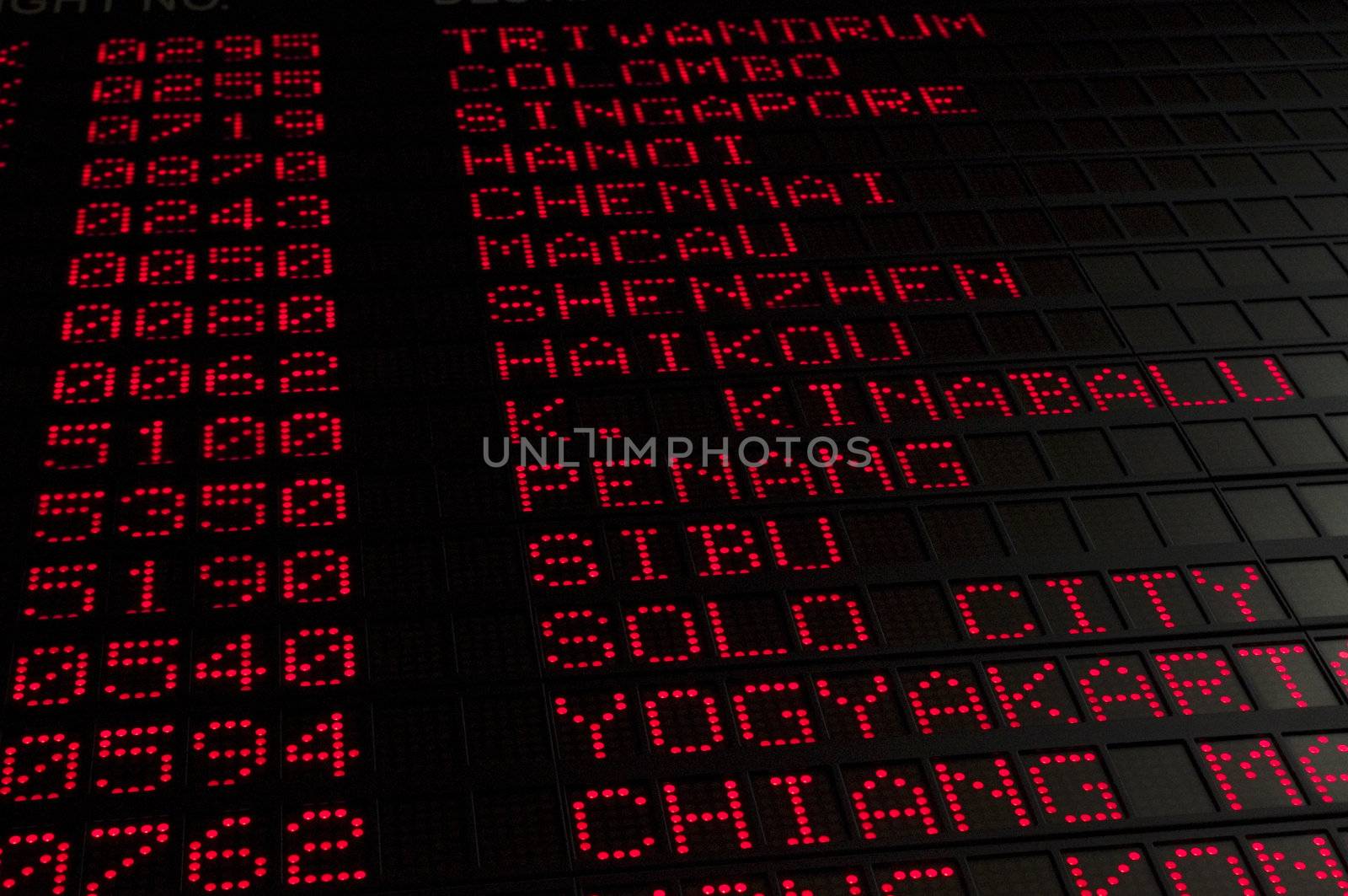flight schedule in airport, destinations of asia cities are shown.