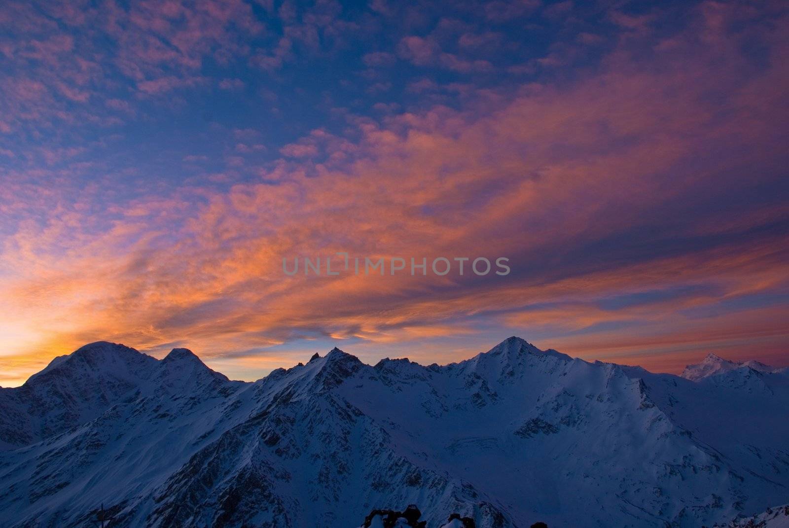 Nature background. Beautiful Sunrise in winter mountains