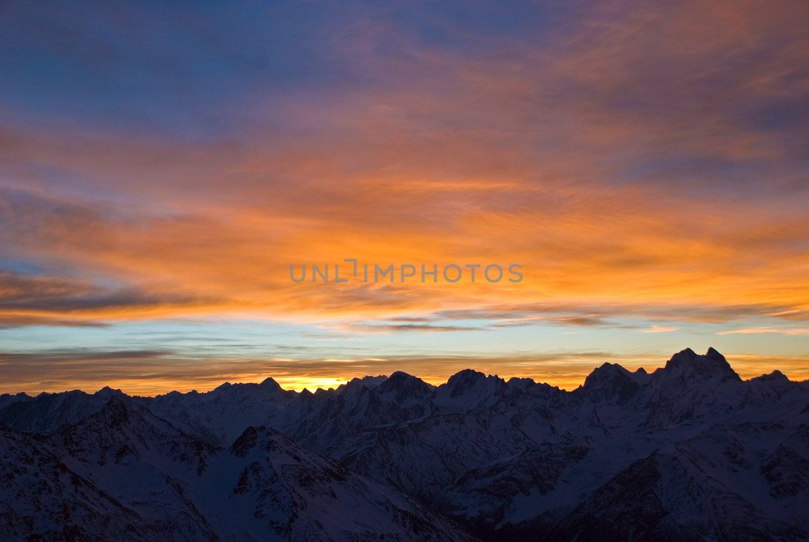 Nature background. Beautiful Sunrise in winter mountains