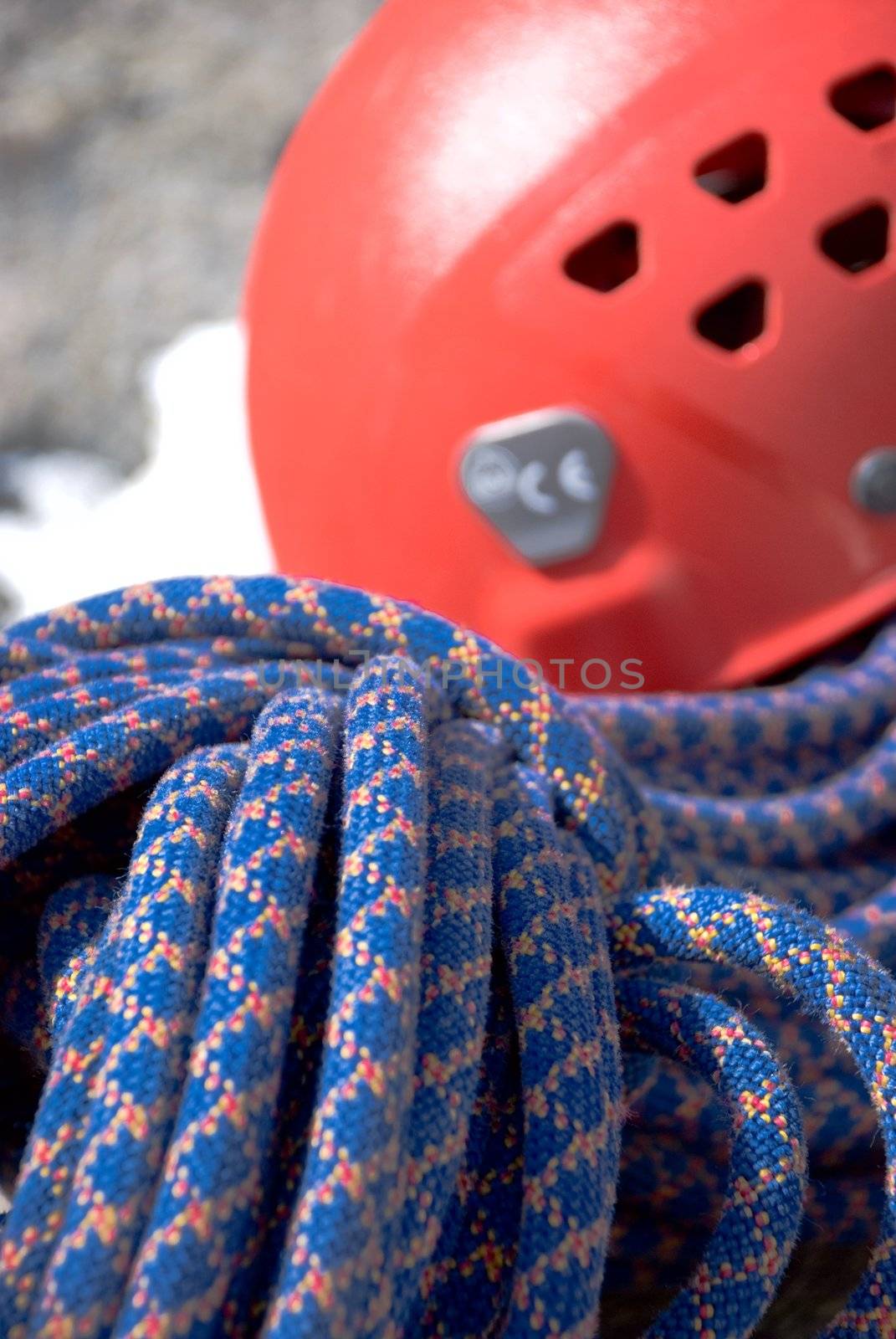 Climbing equipment. Blue climbing rope and halmet