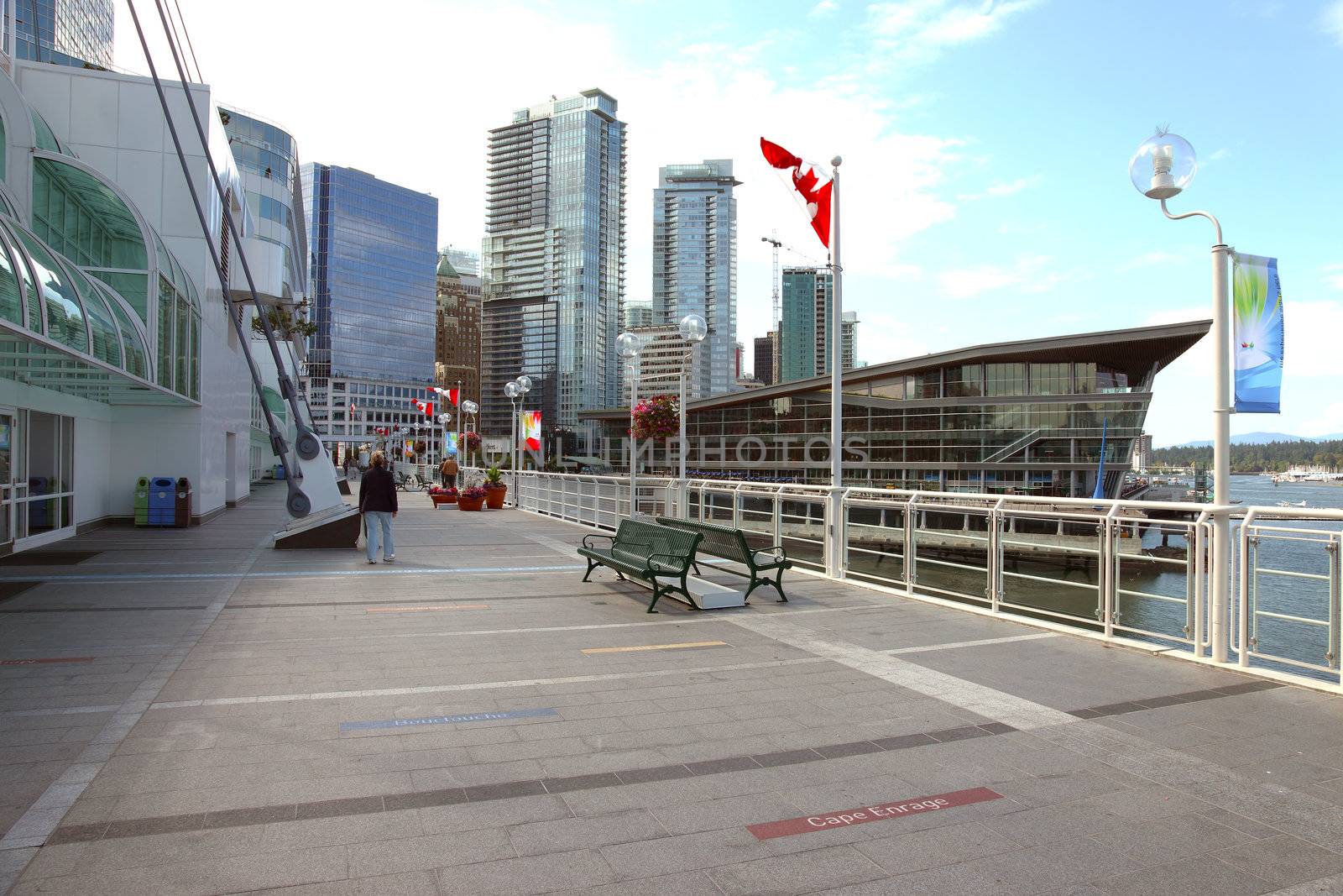 Canada Place promenade with downtown skyscrapers.