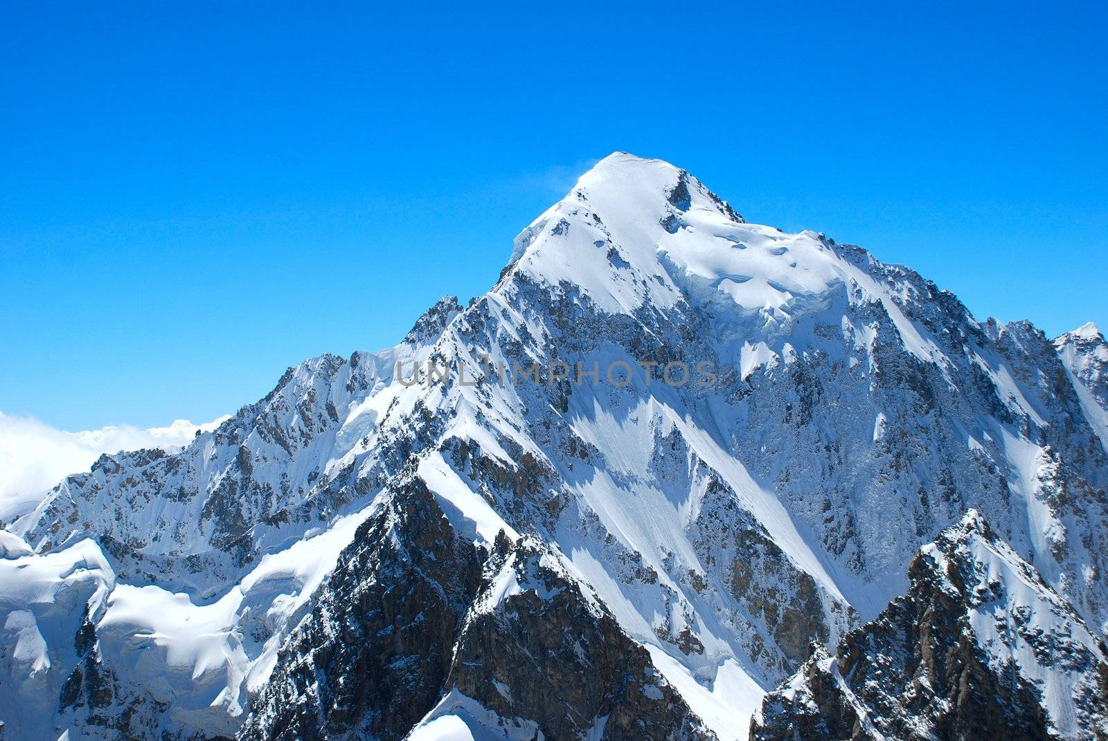 Winter mountains peaks with ice and snow