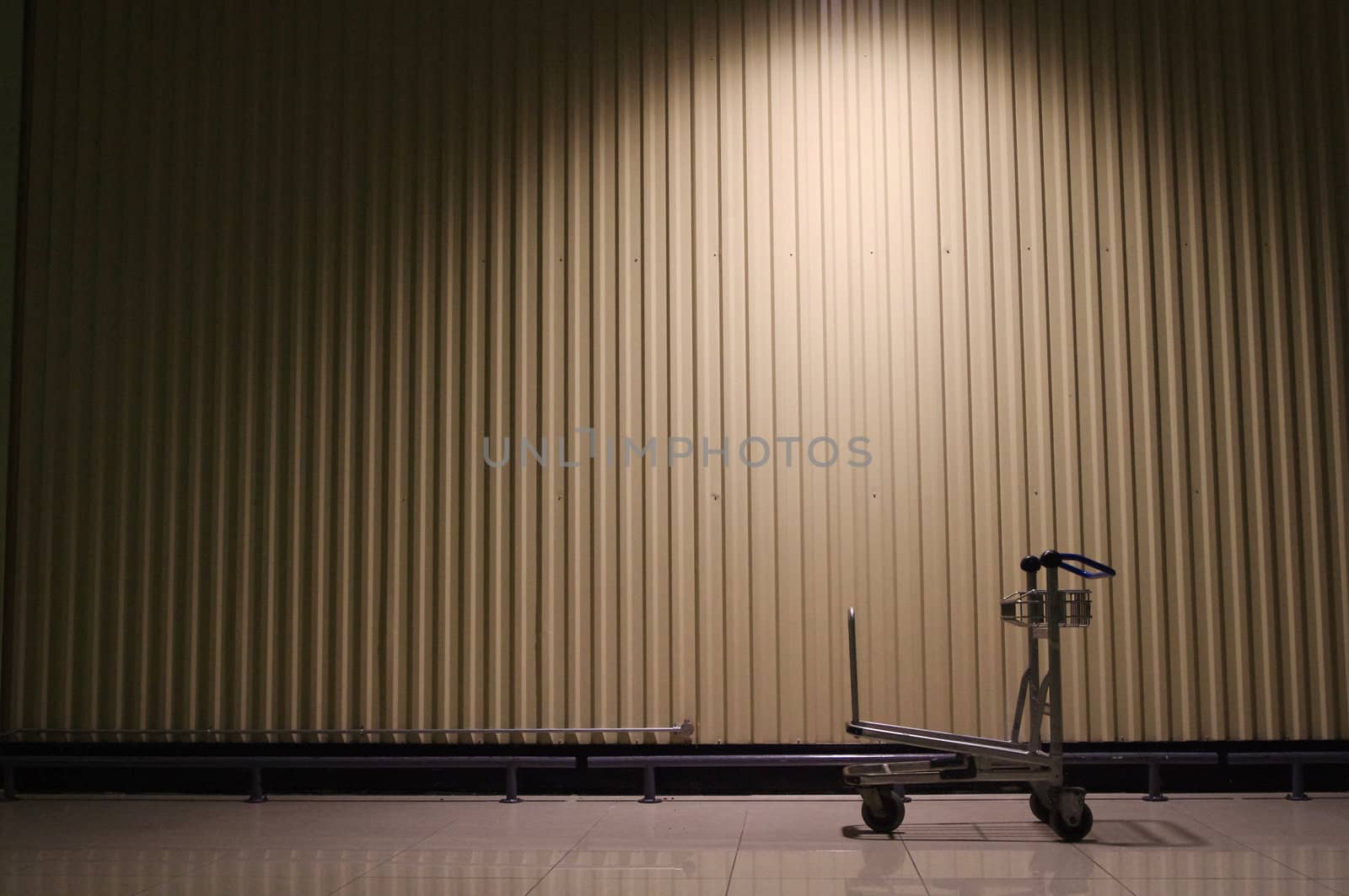 A trolley is left behind in a warehouse