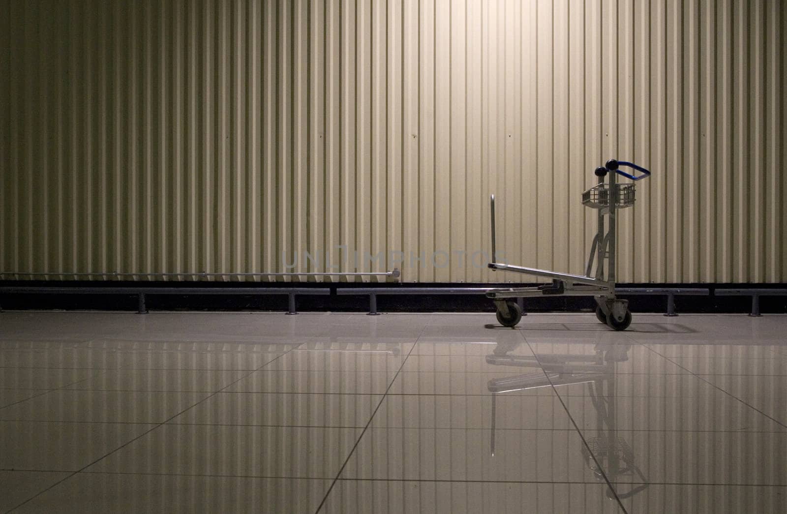 A trolley is left behind in a warehouse
