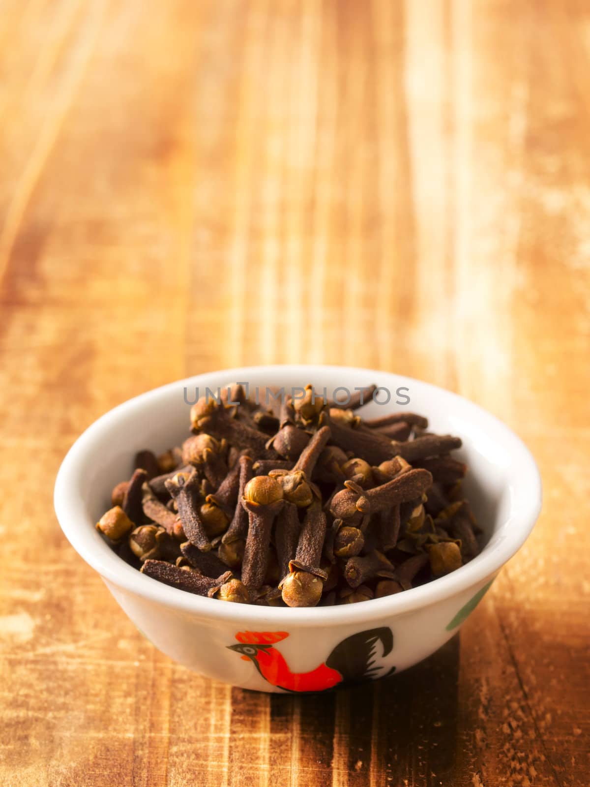 close up of cloves in a bowl