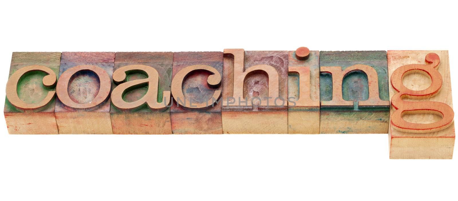coaching  - isolated word in vintage wood letterpress printing blocks