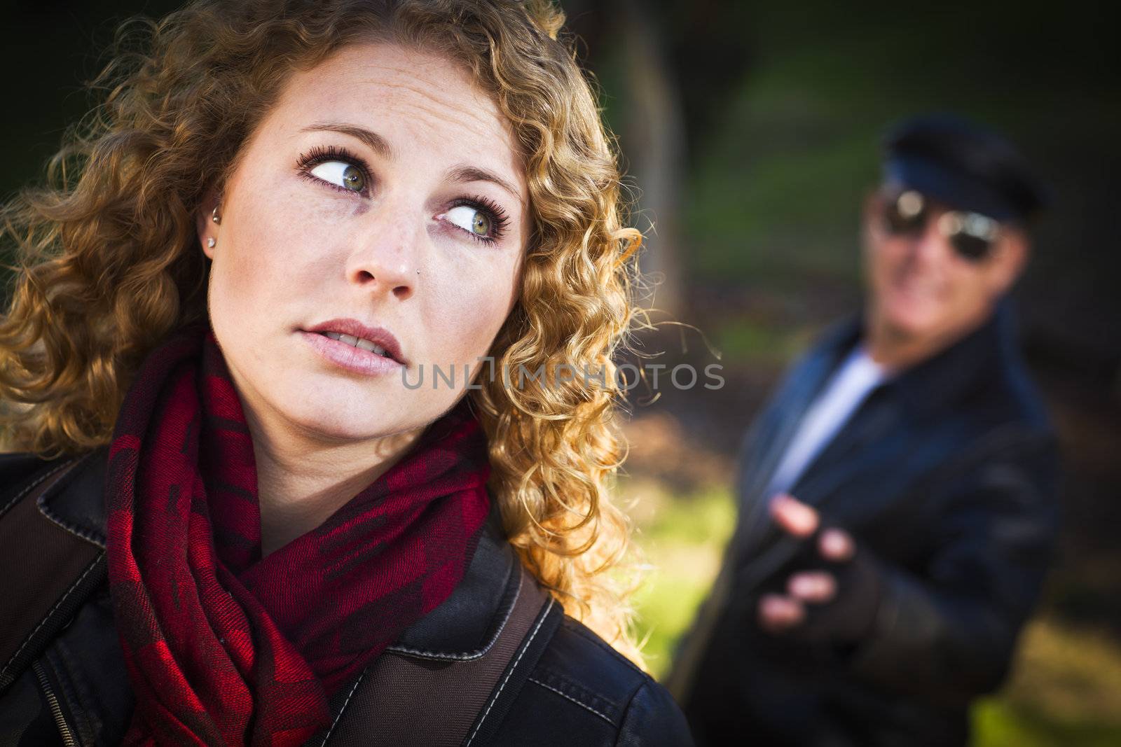 Pretty Young Teen Girl with Mysterious Strange Man Lurking Behind Her.