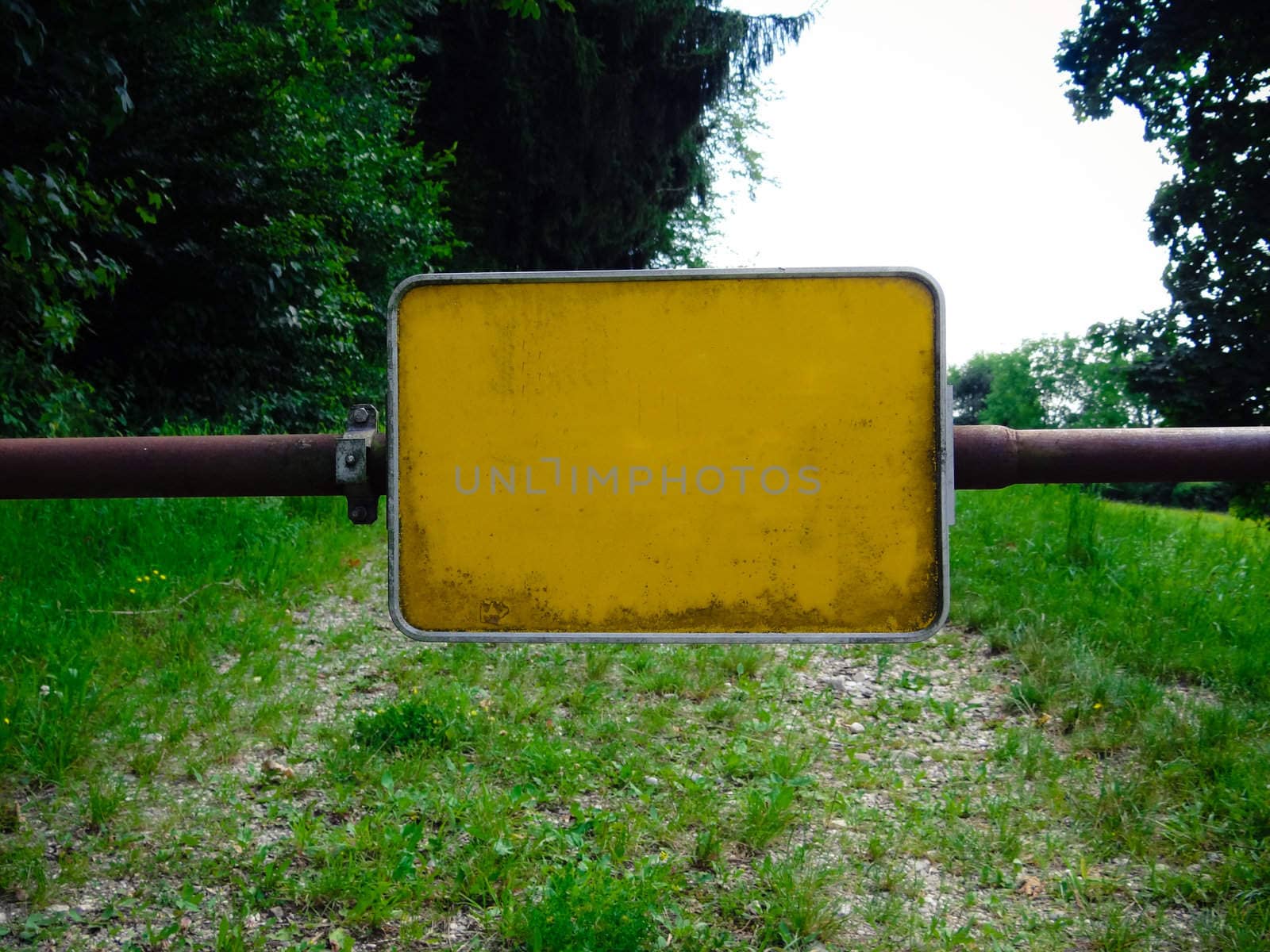 A Sign on a rusty old gate, close-up