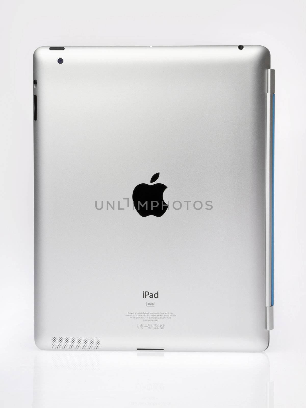 Kiev, Ukraine - June 05, 2011 - Apple Ipad2 with blue Smart cover standing on light gray background. Back View. This second generation Ipad 2 is designed and development by Apple inc. and launched in march 2011. Apple iPad2 with folded Smart cover, isolated on light gray.