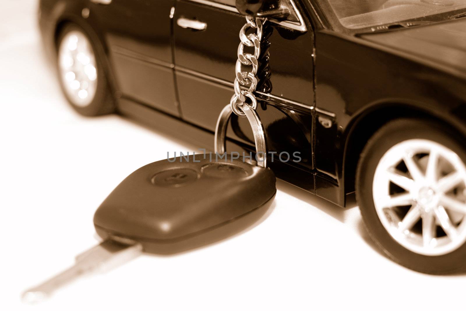 Car key and vehicle on the white background