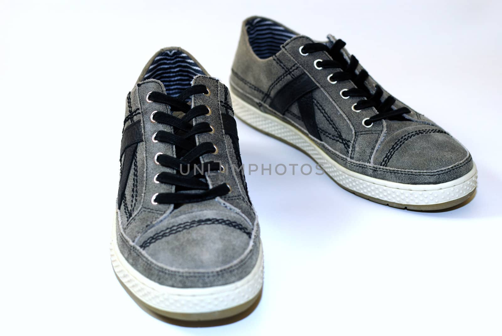 A pair of used comfortable shoes on a white background