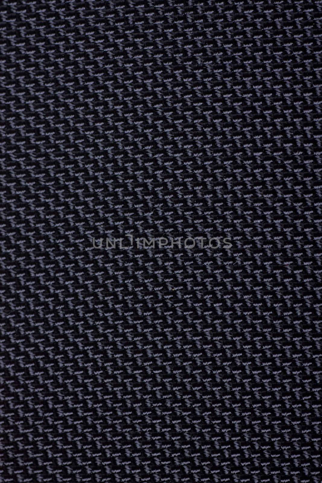 Black textile fabric pattern. Macro view.