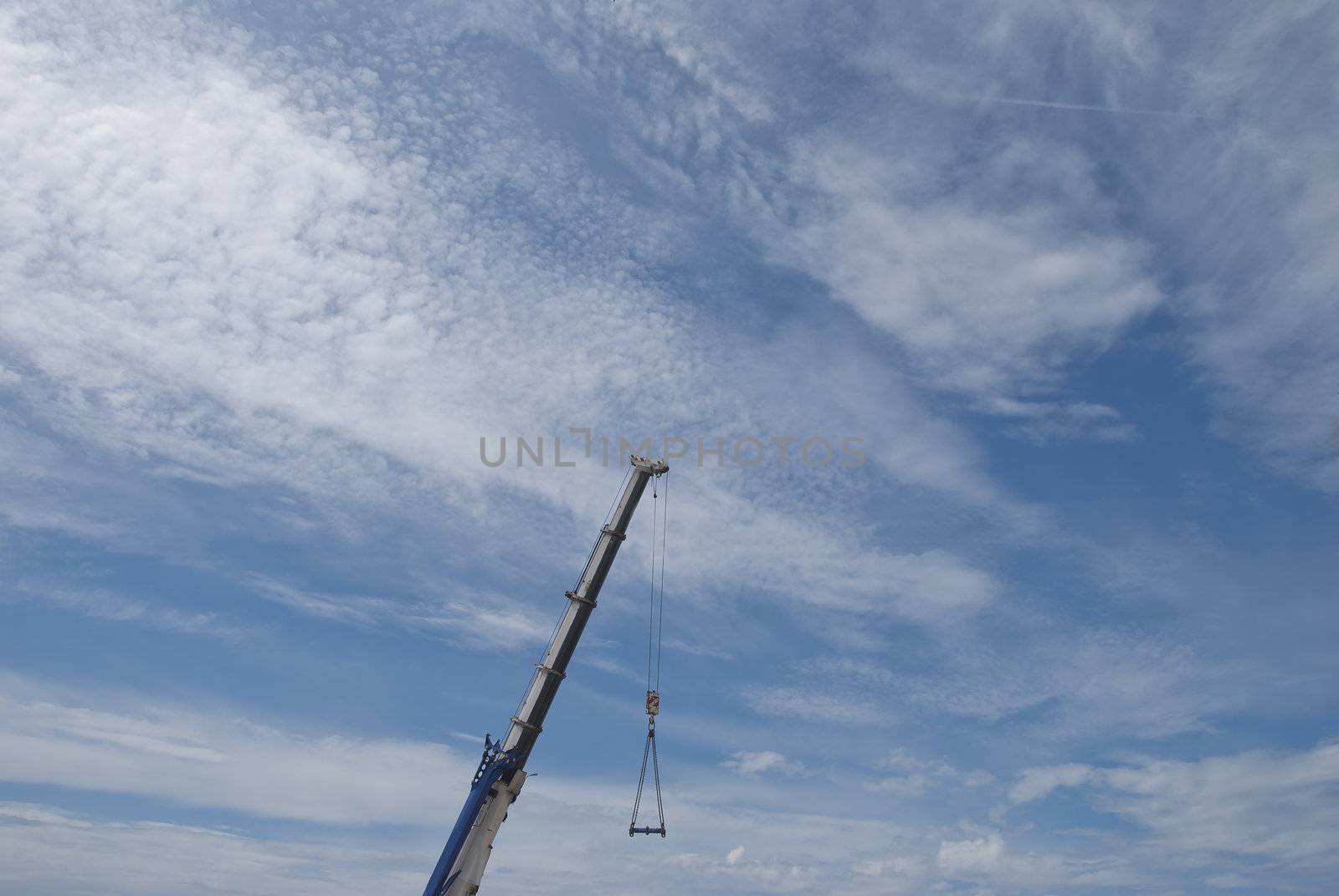 A Mobile Crane Jib against a blue sky