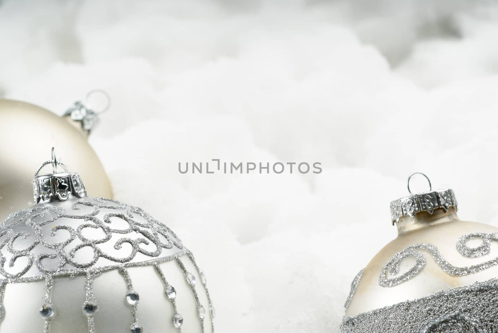 Three New Year's boubles sparkling on white