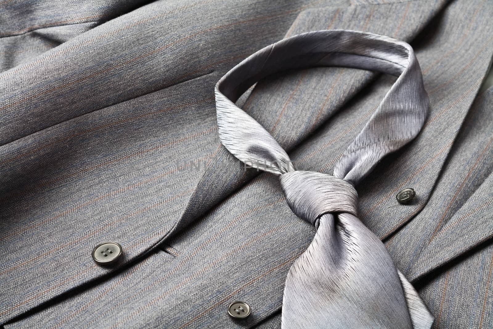 A modern tie and a gray costume