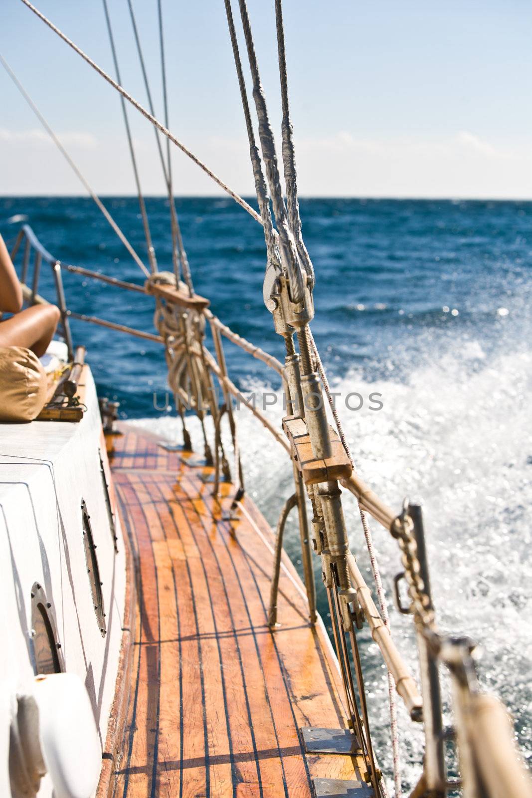 summer series: modern wooden yacht in the sea. Deck view
