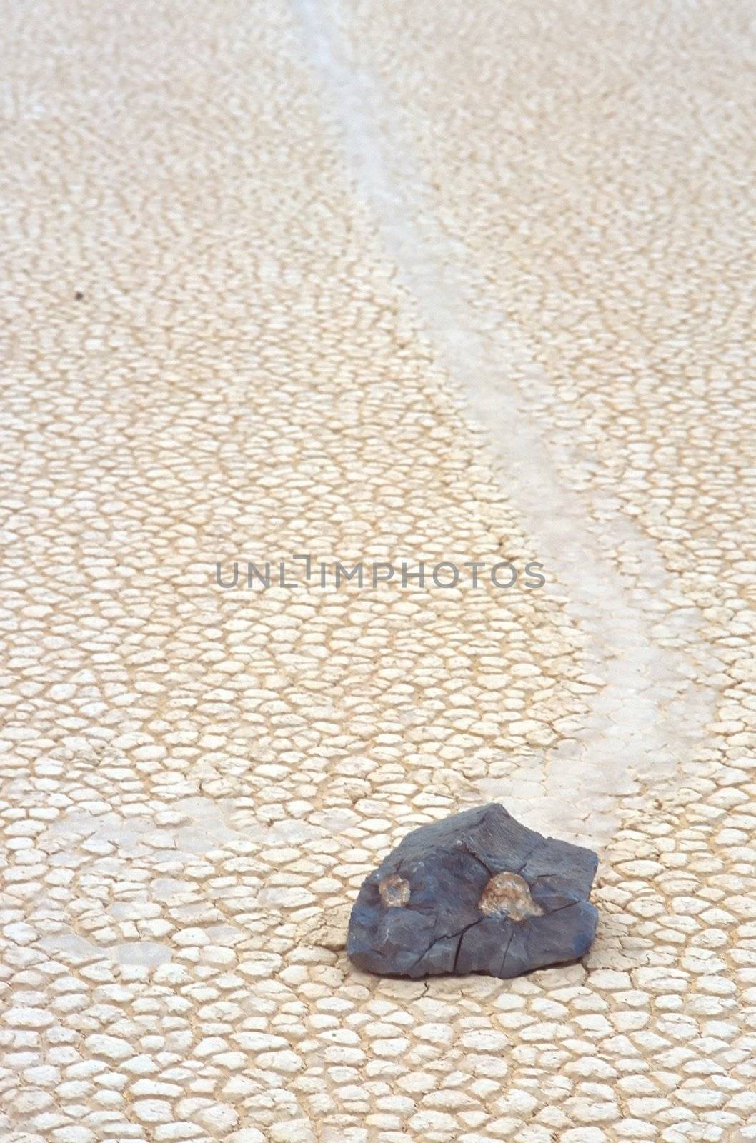 Racetrack Playa is a seasonally dry lake (a playa) located in the northern part of the Panamint Mountains in Death Valley National Park, California, U.S.A.. It is famous for 'sailing stones', rocks that mysteriously move across its surface.