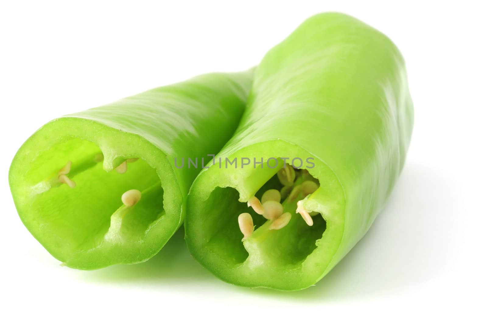 isolated sliced green paprika on white background