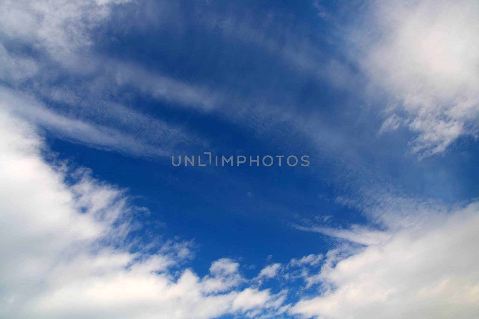deep blue sky with clouds background