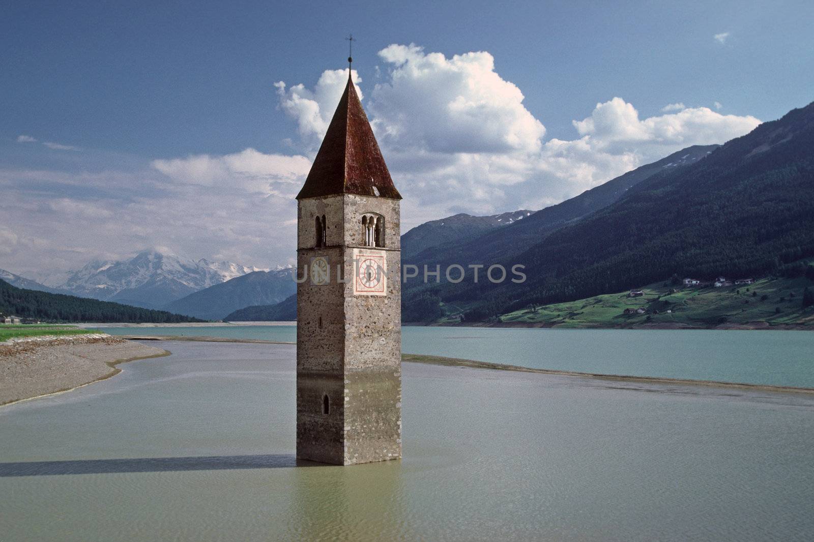 Church tower near Graun, in the Reschensee in South Tyrol, Italy. Graun, Kirchturm, Reschensee