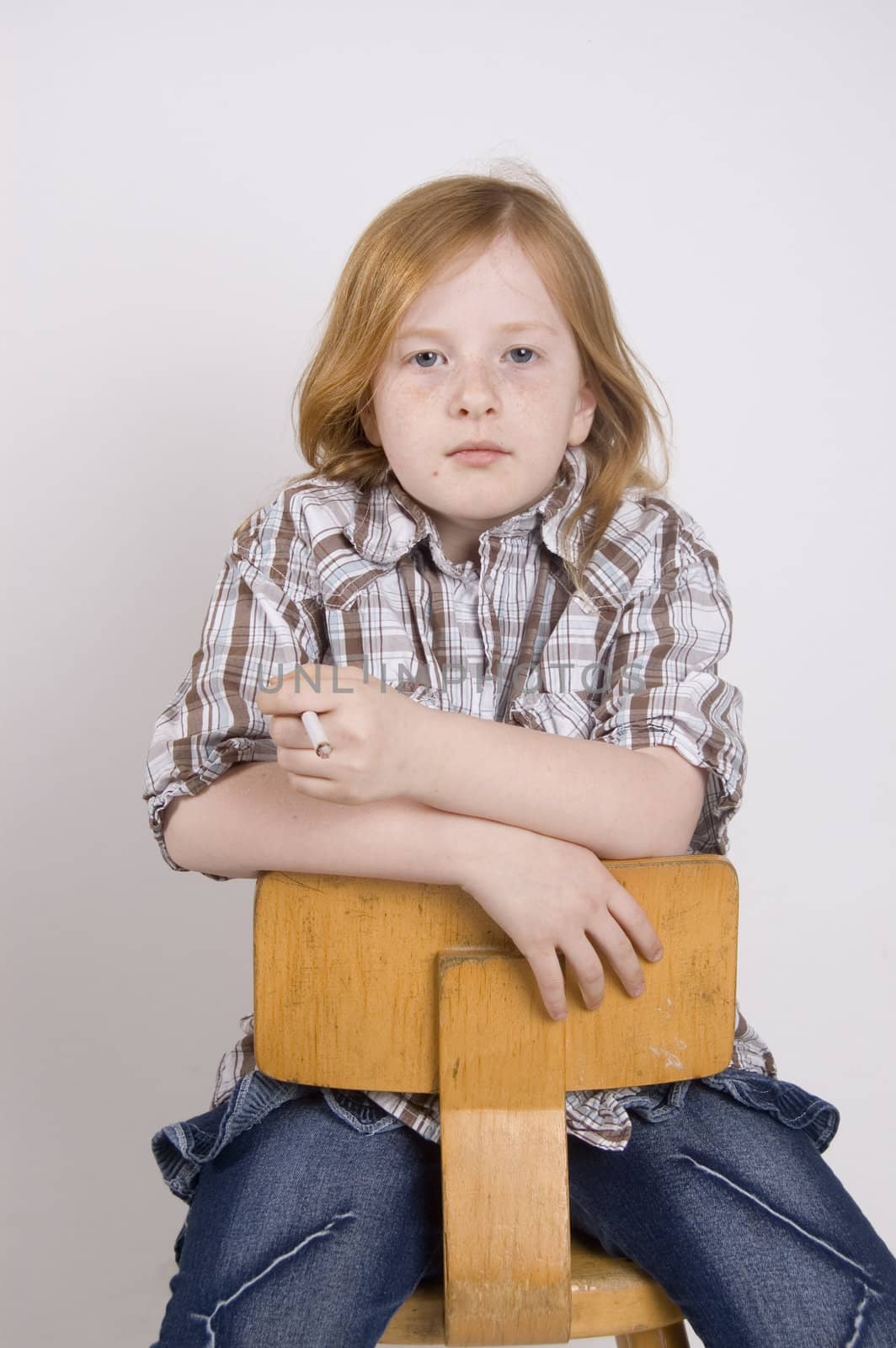 liittle girl sitting on a chair smoking a cigaret by ladyminnie