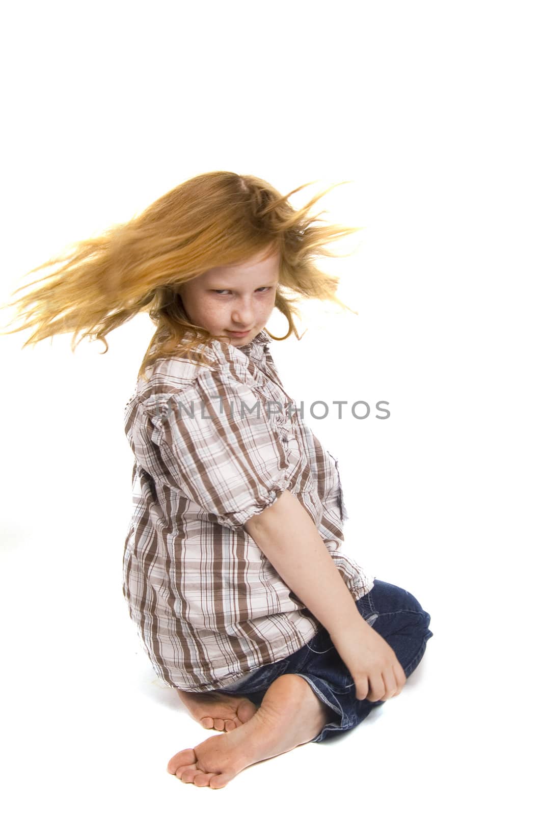 little girl swinging her hair