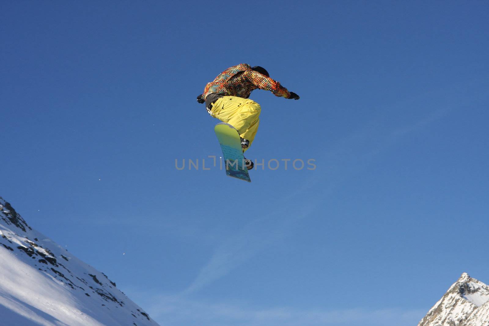Snowboarder jumping high in the air by monner