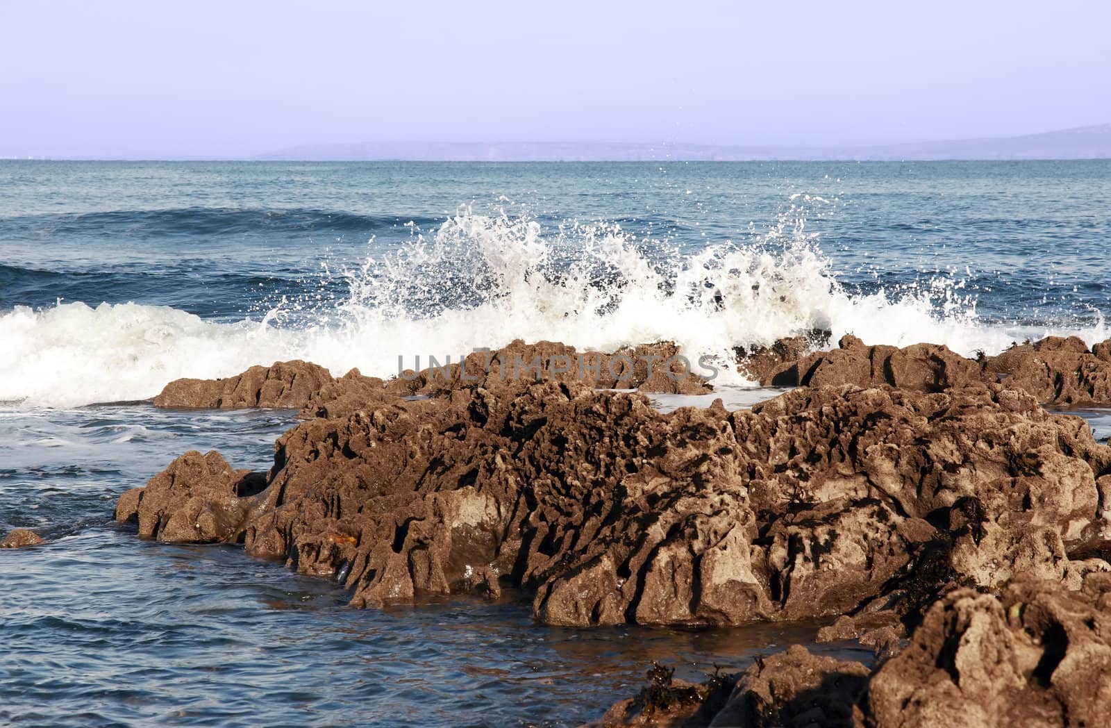 waves rolling over rocks on an irish beach