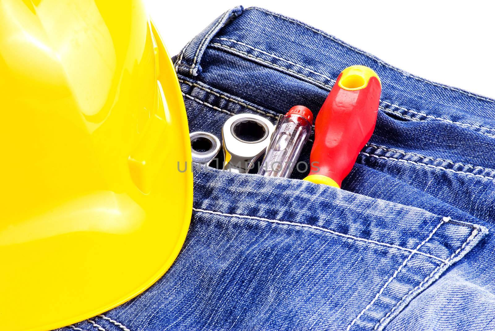 Toolkit in a blue jeans pocket with yellow hat
