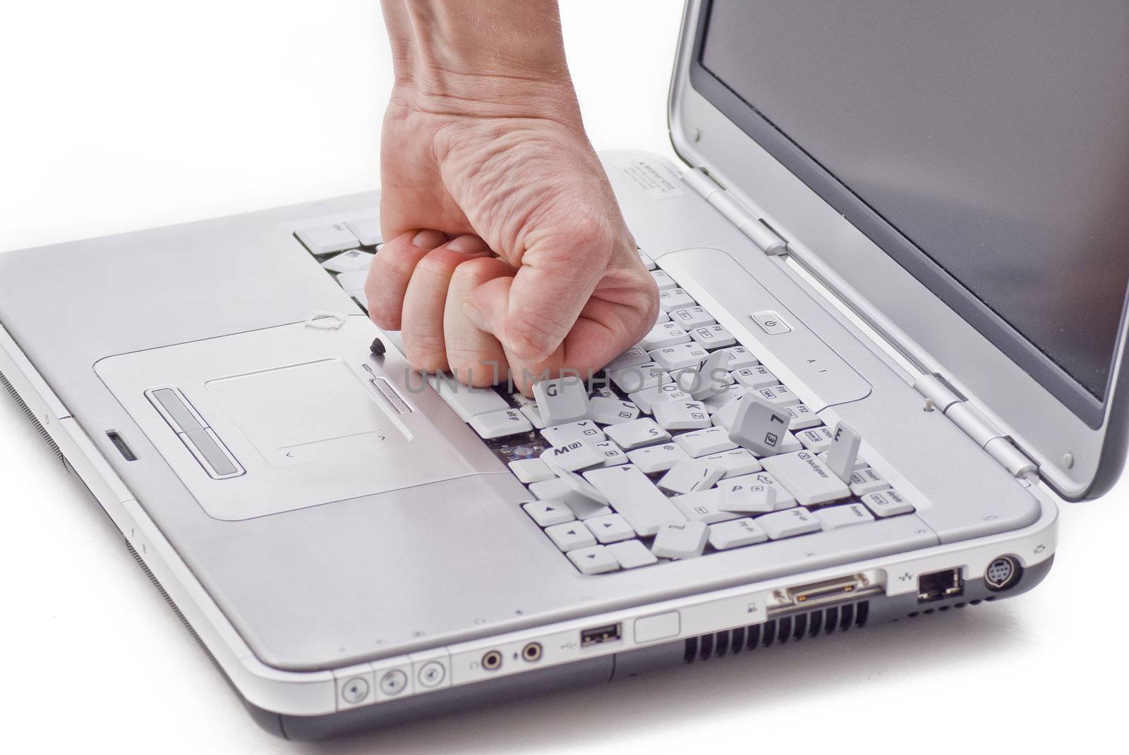 By hand damaged laptop keyboard on white background 
