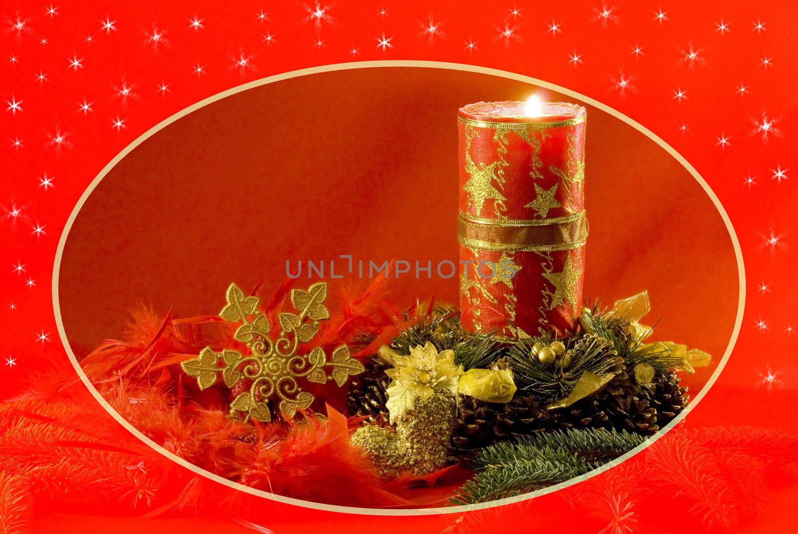 Christmas decorations - red candle, cones, golden snow star, spruce twig and red feathers