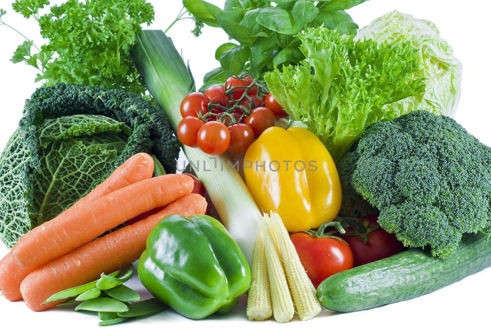 Fresh vegetables and herbs on the white background