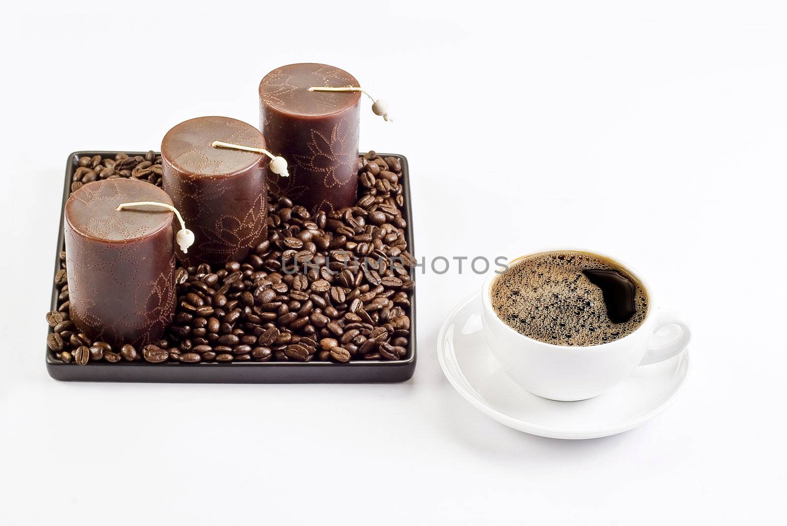 Cup of coffee with coffee beans and candles by caldix