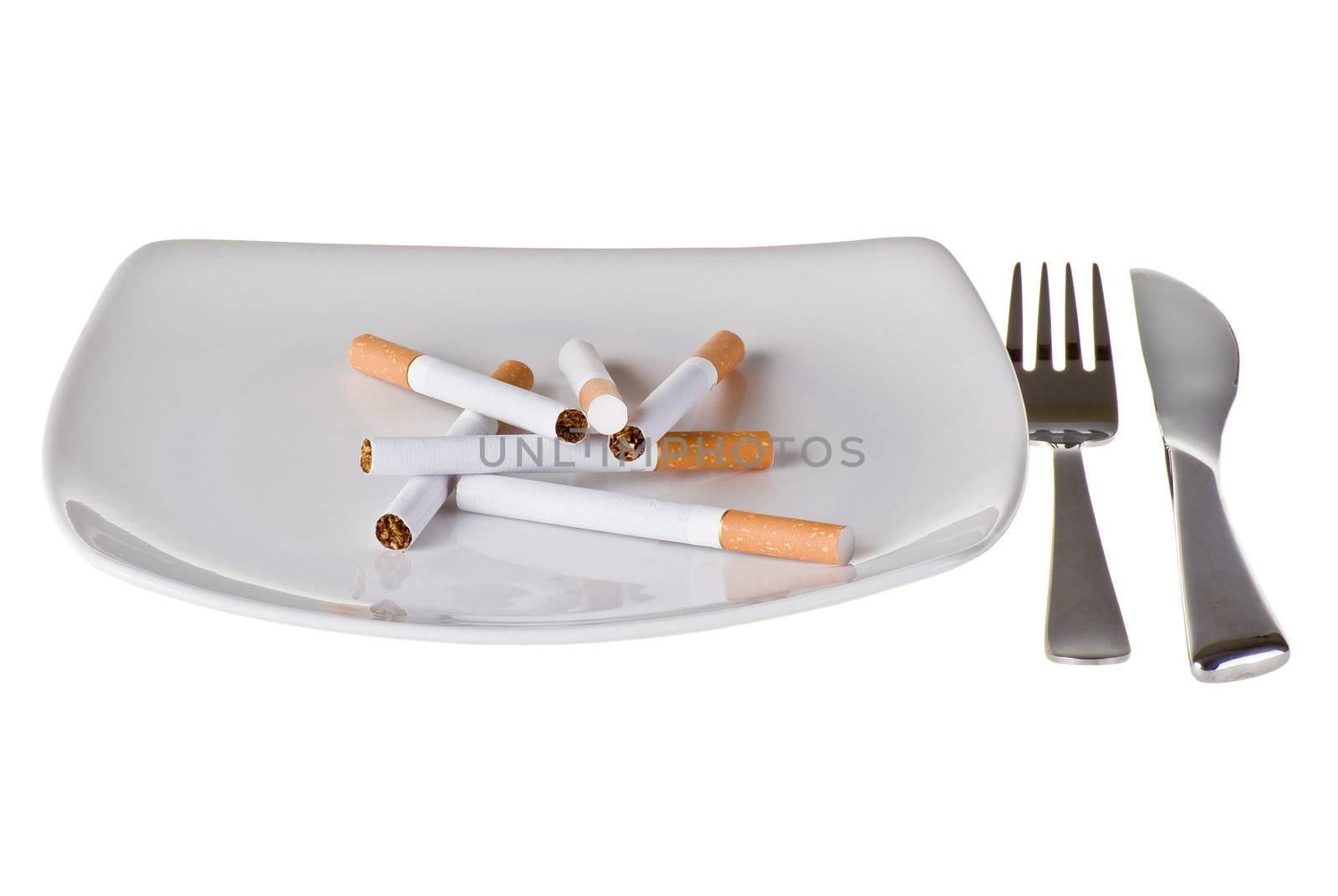 Several cigarettes on the plate with fork and knife
