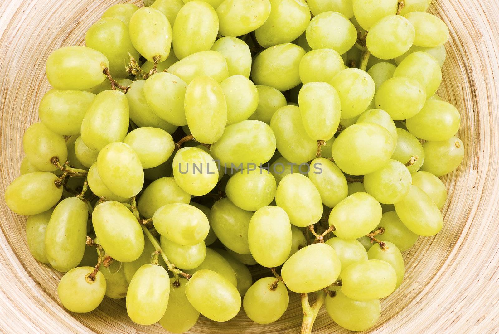 Grape fruits in wooden bowl 