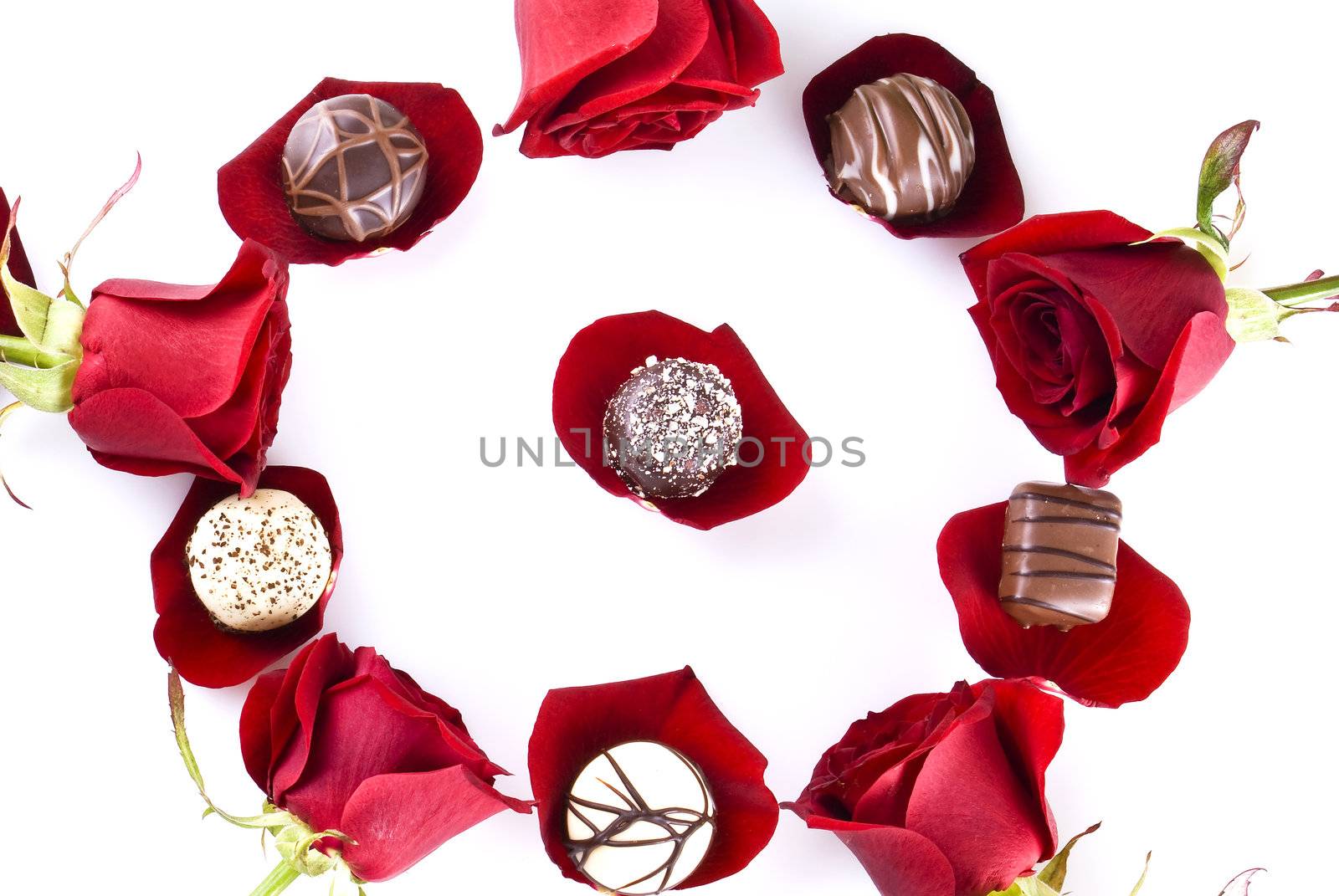 Luxury chocolates and roses over white