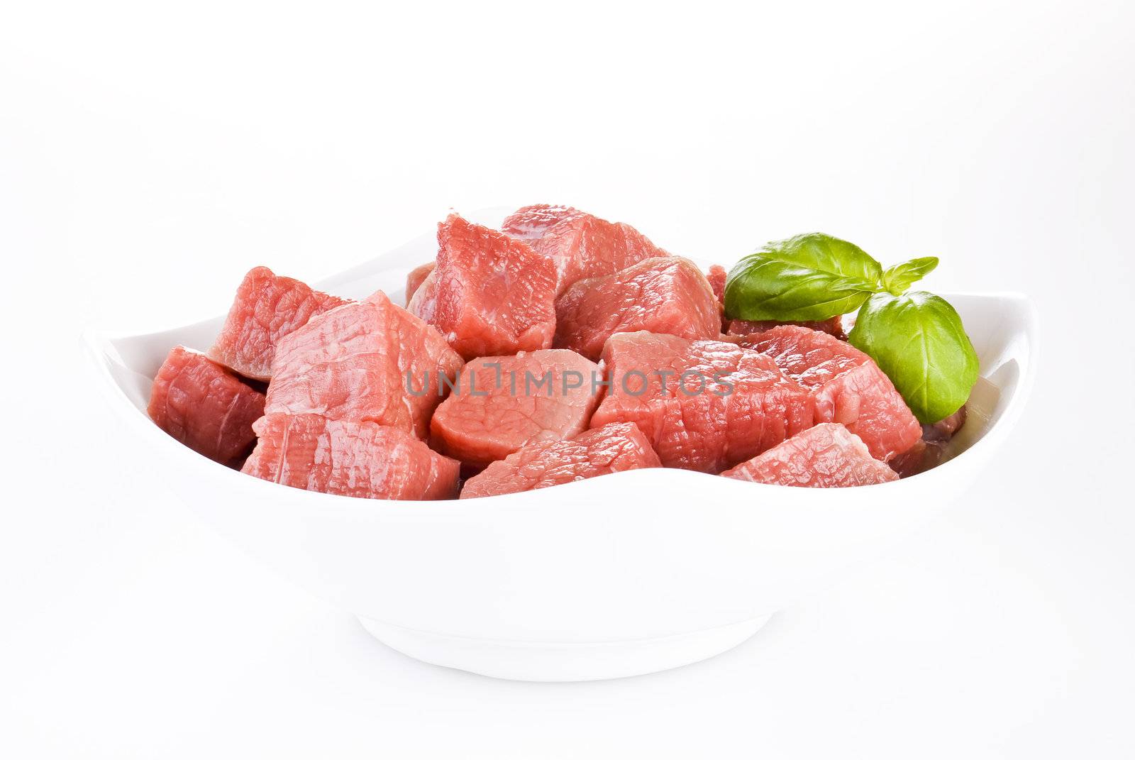 Bowl of diced beef over white background