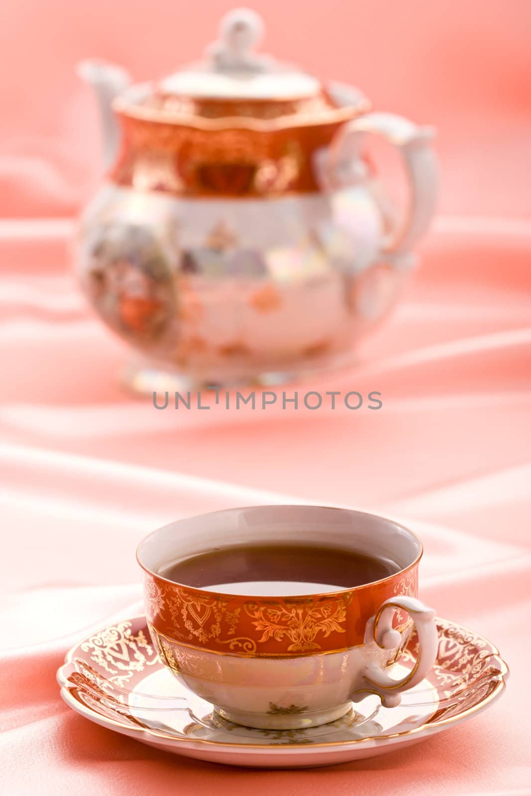 pink still life with cup of tea